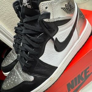 Women’s Air Jordan High OG 1 silver toes.   Metallic black white, Satin inside.